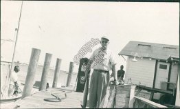 Man Holding Fish, Marina Boat Dock, Gas Pump, Key Largo, FL 1956 RP Postcard
