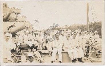 Large Group of Navy Sailors, Sitting on Deck of Ship - Early 1900s RP Postcard